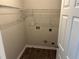 Laundry room with shelving and utility hook ups at 3702 Gray Birch Dr, Decatur, GA 30034