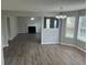 Open concept living and dining area with hardwood floors, fireplace, and an abundance of natural light at 3702 Gray Birch Dr, Decatur, GA 30034