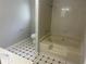 Bathroom with a tub/shower combination, tile flooring and single sink vanity at 5340 Forest Pl, Stone Mountain, GA 30088