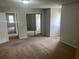 Bedroom with closet featuring mirrored doors and carpeted flooring at 5340 Forest Pl, Stone Mountain, GA 30088
