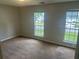 Bedroom featuring neutral paint, carpet flooring, two windows that offer lots of natural light at 5340 Forest Pl, Stone Mountain, GA 30088