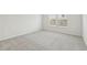 This carpeted bedroom has natural light from two windows at 6908 Winchester Pl, Fairburn, GA 30213