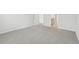 The carpeted bedroom features a doorway leading to other rooms at 6908 Winchester Pl, Fairburn, GA 30213