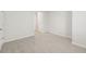 The carpeted bedroom features a doorway leading to other rooms at 6908 Winchester Pl, Fairburn, GA 30213