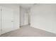 This carpeted bedroom has neutral walls and a closet for storage at 6908 Winchester Pl, Fairburn, GA 30213