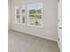 Well-lit bedroom featuring new carpet and a bright view from the window at 6908 Winchester Pl, Fairburn, GA 30213