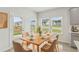 Dining area with a table set for six near an outside patio door at 6908 Winchester Pl, Fairburn, GA 30213