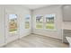 Bright dining area with large windows and a view of the outdoors at 6908 Winchester Pl, Fairburn, GA 30213