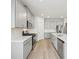 Contemporary kitchen features gray cabinets, stainless steel appliances, and modern finishes at 6908 Winchester Pl, Fairburn, GA 30213