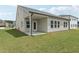 Well-landscaped backyard featuring a covered patio, perfect for enjoying the outdoors at 7760 Sheffield Ter, Fairburn, GA 30213