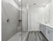 Contemporary bathroom featuring a frameless glass shower and tile surround at 7760 Sheffield Ter, Fairburn, GA 30213