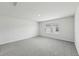 Bedroom with gray carpet and natural light from large windows at 7760 Sheffield Ter, Fairburn, GA 30213