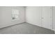 Bright, unfurnished bedroom with gray carpet and a window at 7760 Sheffield Ter, Fairburn, GA 30213