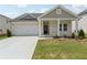 Charming single-story home featuring a two-car garage and a welcoming front porch at 7760 Sheffield Ter, Fairburn, GA 30213