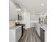 Modern kitchen with stainless appliances, sleek gray cabinets and plenty of counter space at 7760 Sheffield Ter, Fairburn, GA 30213