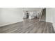 Open concept kitchen and living space featuring modern appliances and neutral walls at 7760 Sheffield Ter, Fairburn, GA 30213