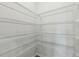 Spacious walk-in closet with white shelving at 7760 Sheffield Ter, Fairburn, GA 30213