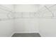 Empty walk-in closet with white metal shelving at 7760 Sheffield Ter, Fairburn, GA 30213