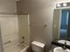 Bathroom featuring shower, tub, toilet, and vanity with mirror and lighting at 1247 To Lani Farm Rd, Stone Mountain, GA 30083
