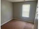 Bedroom with neutral walls, carpet, and natural light from the window at 1247 To Lani Farm Rd, Stone Mountain, GA 30083
