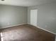 Bedroom with neutral walls, carpet, closet, and electrical outlets at 1247 To Lani Farm Rd, Stone Mountain, GA 30083