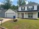 Charming two-story home with attached garage and well-maintained lawn at 1247 To Lani Farm Rd, Stone Mountain, GA 30083