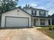 Charming two-story home features a two-car garage and a welcoming front porch with classic columns at 1247 To Lani Farm Rd, Stone Mountain, GA 30083