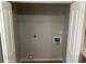 Walk in laundry closet with hookups and overhead shelf at 1247 To Lani Farm Rd, Stone Mountain, GA 30083