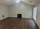 Spacious living room with hardwood floors, vaulted ceilings, a fireplace, and lots of natural light at 1247 To Lani Farm Rd, Stone Mountain, GA 30083