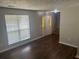 Cozy living room with hardwood floors, staircase, and a bright window for natural light at 1247 To Lani Farm Rd, Stone Mountain, GA 30083