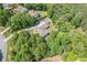 Overhead shot of a secluded property with a sprawling lawn and mature trees, offering privacy and a peaceful setting at 132 Copper Hills Dr, Canton, GA 30114