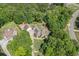 Discover the beauty of this home from above, nestled among mature trees on a desirable corner lot at 132 Copper Hills Dr, Canton, GA 30114