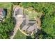 Aerial view of the property showcasing lush landscaping, the home, and the surrounding area at 132 Copper Hills Dr, Canton, GA 30114
