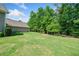 Sprawling backyard with lush lawn offers plenty of space for outdoor activities and gardening at 132 Copper Hills Dr, Canton, GA 30114