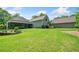 Well-maintained backyard with expansive lawn, and charming landscaping at 132 Copper Hills Dr, Canton, GA 30114