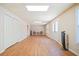 Finished basement with wood-look flooring, neutral walls, and multiple access doors at 132 Copper Hills Dr, Canton, GA 30114