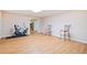 Open basement featuring wood-look floors, neutral walls, and space for exercise equipment at 132 Copper Hills Dr, Canton, GA 30114