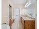Spacious bathroom featuring a tiled floor, granite countertop, and ample natural light at 132 Copper Hills Dr, Canton, GA 30114