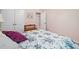Spare bedroom featuring a patterned bedspread and a double-door closet with a bench at 132 Copper Hills Dr, Canton, GA 30114