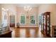 Elegant dining room with hardwood floors, a chandelier, and large windows with outside views at 132 Copper Hills Dr, Canton, GA 30114