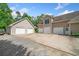 Spacious driveway and attached three-car garage plus a separate two-car garage, providing ample parking at 132 Copper Hills Dr, Canton, GA 30114