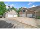 Property features large garage with a spacious driveway offering ample parking for multiple vehicles at 132 Copper Hills Dr, Canton, GA 30114