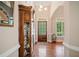 Inviting foyer with hardwood floors, a decorative cabinet, and a charming front door with sidelights at 132 Copper Hills Dr, Canton, GA 30114