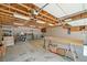 Spacious garage featuring overhead lighting and plenty of storage space, perfect for workshop or parking at 132 Copper Hills Dr, Canton, GA 30114