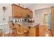 Spacious kitchen with granite countertops, wooden cabinets, and a breakfast bar at 132 Copper Hills Dr, Canton, GA 30114