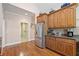 Bright kitchen with a stainless steel refrigerator and adjoining laundry room at 132 Copper Hills Dr, Canton, GA 30114
