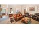 Comfortable living room featuring neutral carpet and paint, and plush leather seating at 132 Copper Hills Dr, Canton, GA 30114