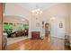 Inviting living room featuring hardwood floors, a chandelier, and an open layout at 132 Copper Hills Dr, Canton, GA 30114