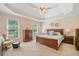 Spacious main bedroom with large windows, tray ceiling, ceiling fan and carpet flooring at 132 Copper Hills Dr, Canton, GA 30114