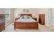 Bright main bedroom with wood furniture and windows providing natural light at 132 Copper Hills Dr, Canton, GA 30114